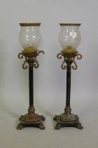 Pair of wood and composition candle lamps, 70cmhigh