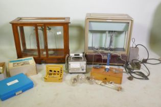 Scientific instruments and scales; antique balance scales in mahogany and glass case, labelled