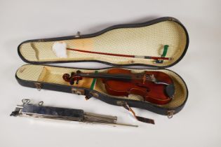 An early C20th French Medio Fino 1/8th size violin with one piece back, bow, hard carry case and