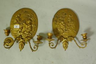 Pair of ormolu two branch wall sconces with raised classical decoration, 32 x 30cm