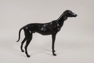 A bronze sculpture of a whippet, 33cm long