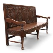 19th century Gothic Revival heavily carved oak settle or hall bench