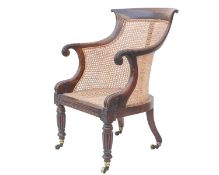 A Regency rosewood bergere library armchair.