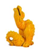 A Burmantofts grotesque pottery dragon figure.