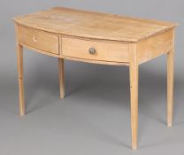A 19th Century stripped and polished pine bow front side table, fitted 2 frieze drawers, raised on