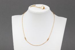 A 9ct gold fine link necklace 38cm 1.7g, together with a gold dress pin front set a diamond (the