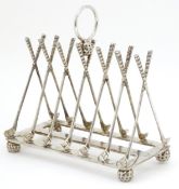 A 21stC novelty silver plate 6-slice toast rack the bars formed as golf clubs and standing on four