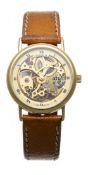 TISSOT - montre squelette en or jaune 750, mouvement à remontage mécanique