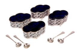 A SET OF FOUR EDWARD VII SILVER OVAL SALTS