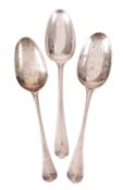 A GEORGE II SILVER OLD ENGLISH PATTERN ‘SHELL BACK’ TABLE SPOON