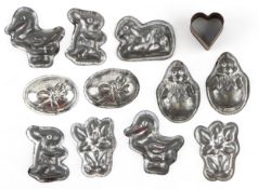 Collection of vintage metal candy moulds including Easter eggs, rabbits and flowers, the largest 5.