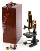 Vintage W Watson & Son Ltd. microscope with fitted mahogany case, the case 35cm high.