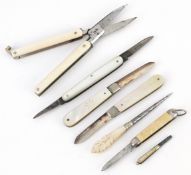 Antique and later pocket tools including two mother of pearl flanked pocket knives with silver