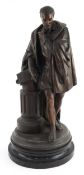 Bronzed spelter figure of the poet Torquato Tasso leaning on a column, raised on an ebonised base,