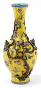 Chinese porcelain bottleneck vase moulded in relief with a mango tree, hand painted onto a yellow