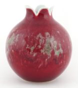 Chinese porcelain pomegranate vase having a sang de boeuf glaze, six figure character marks to the