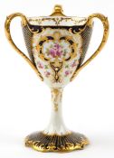 Wedgwood porcelain three handled pedestal loving cup finely hand painted and gilded with roses, 22cm