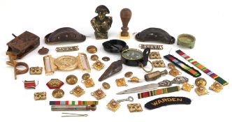 Militaria including uniform buttons, cloth patches and a compass.