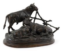 After Jules Moigniez, patinated bronze study of cattle by a fence, 30cm wide.