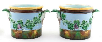Pair of Wedgwood Majolica planters with mask handles, moulded in relief with grapevines, numbered