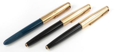 Three Parker fountain pens.