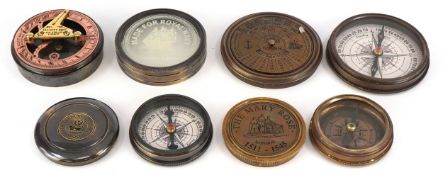 Four nautical interest brass cased compasses and sextants, the largest 7.5cm in diameter.