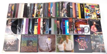 Collection of vinyl LP records including Eric Clapton, Jean-Michel Jarre, Jefferson Airplane,