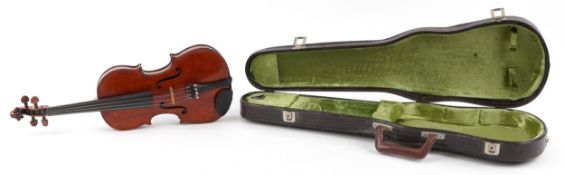 Old wooden violin having a two piece back and paper label to the interior inscribed Nicolas
