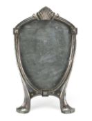 Art Nouveau pewter easel photo frame with shield aperture, indistinct marks and numbered 1102,