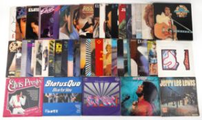 Collection of vinyl LP records including Elvis Presley, T-Rex, Diana Ross, ABBA, Cliff Richard, Huey