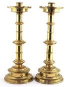 Pair of Arts & Crafts brass candlesticks, 32cm high.