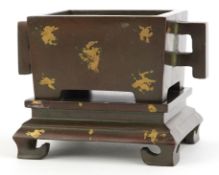 Chinese patinated bronze rectangular incense burner with twin handles, gold coloured splashes and
