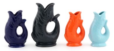 Four ceramic gluggle fish jugs including Foster's Studio Pottery Cornwall, Wade Artifact of Plymouth