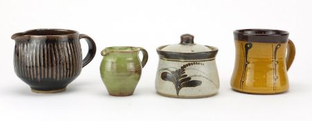 David Leach and Lowerdown studio pottery comprising a jam pot, two jugs and a mug, impressed