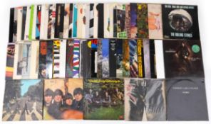 Collection of vinyl LP records including The Beatles, Derek & The Dominos, Emerson, Lake & Palmer,