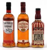 Three bottles of liqueurs including Southern Comfort and Early Times Fire Eater.