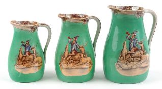 Graduated set of three Victorian pottery jugs on a green ground featuring 'The Huntsman',