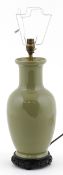 Chinese celadon baluster vase converted into a table lamp, raised on a wooden base, 36cm high