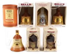 Six Bell's whisky decanters, various sizes, including The Celebration Scotch from the House of