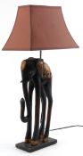 African interest wooden and metal table lamp in the form of an elephant, overall 80cm high.