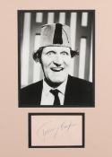 Tommy Cooper photograph with signature, 44cm x 34cm including the frame.