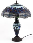 Tiffany style dragonfly design table lamp with leaded glass shade, 65cm high.
