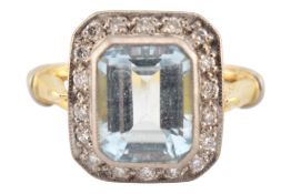 HALLMARKED 18CT GOLD & AQUAMARINE & DIAMOND HALO RING