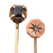 TWO EARLY 20TH CENTURY YELLOW METAL GEM SET STICK PINS