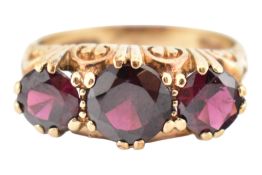 HALLMARKED 9CT GOLD THREE STONE GARNET RING