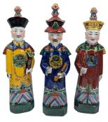 THREE 20TH CENTURY CHINESE QING EMPEROR PORCELAIN FIGURINES 20世纪清三代皇帝立像