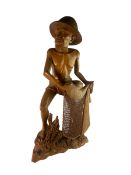 LARGE BALINESE HARDWOOD CARVING OF A FISHERMAN