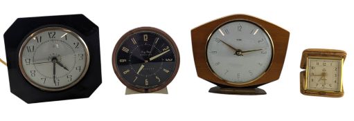 A COLLECTION OF CLOCKS AND A TRAVEL ALARM - FOUR IN TOTAL