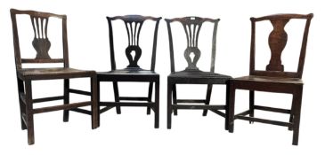 HARLEQUIN SET OF FOUR GEORGE III OAK WOOD DINIGN CHAIRS