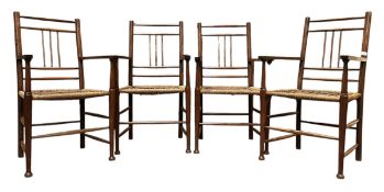 FOUR ANGLO COLONIAL EARLY 20TH CENTURY TEAK & RUSH SEAT DINING CHAIRS